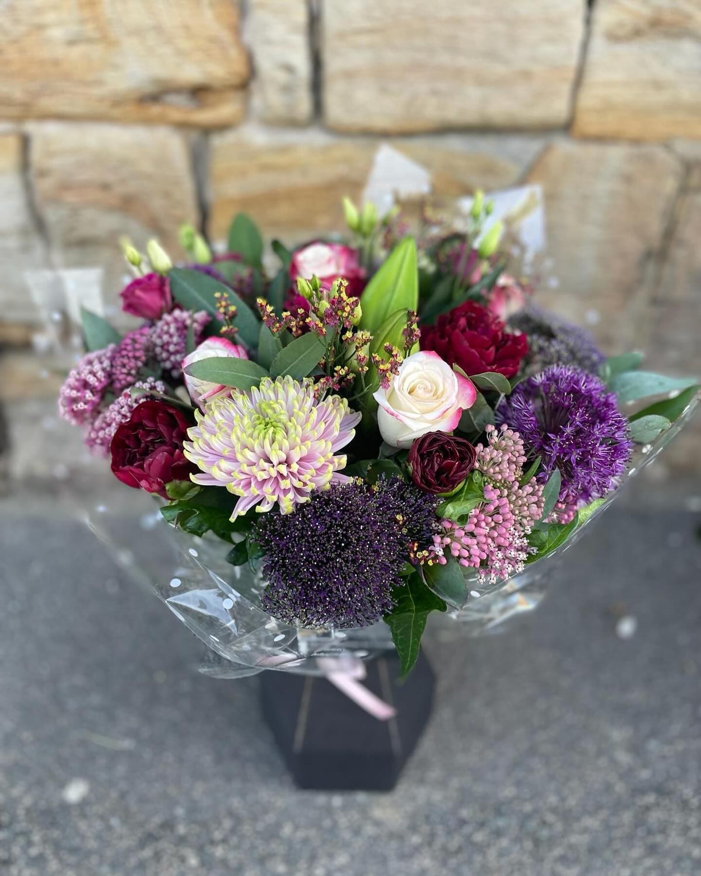 Bouquet of flowers outside a stone built flower shop