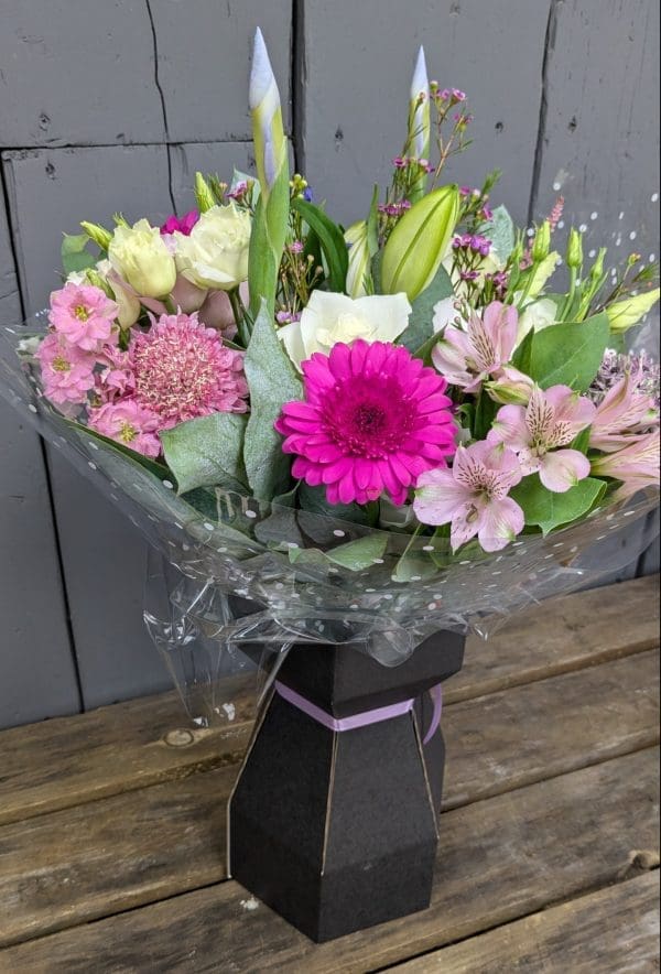 Florist's Choice Bouquet of flowers with bright pink and purple colours, lilies and foliage