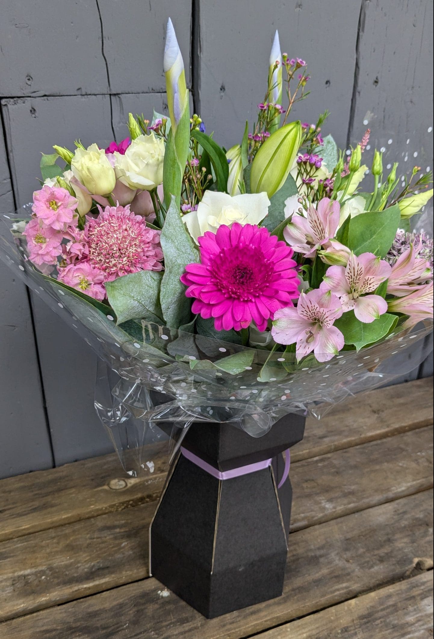 Florist's Choice Bouquet of flowers with bright pink and purple colours, lilies and foliage