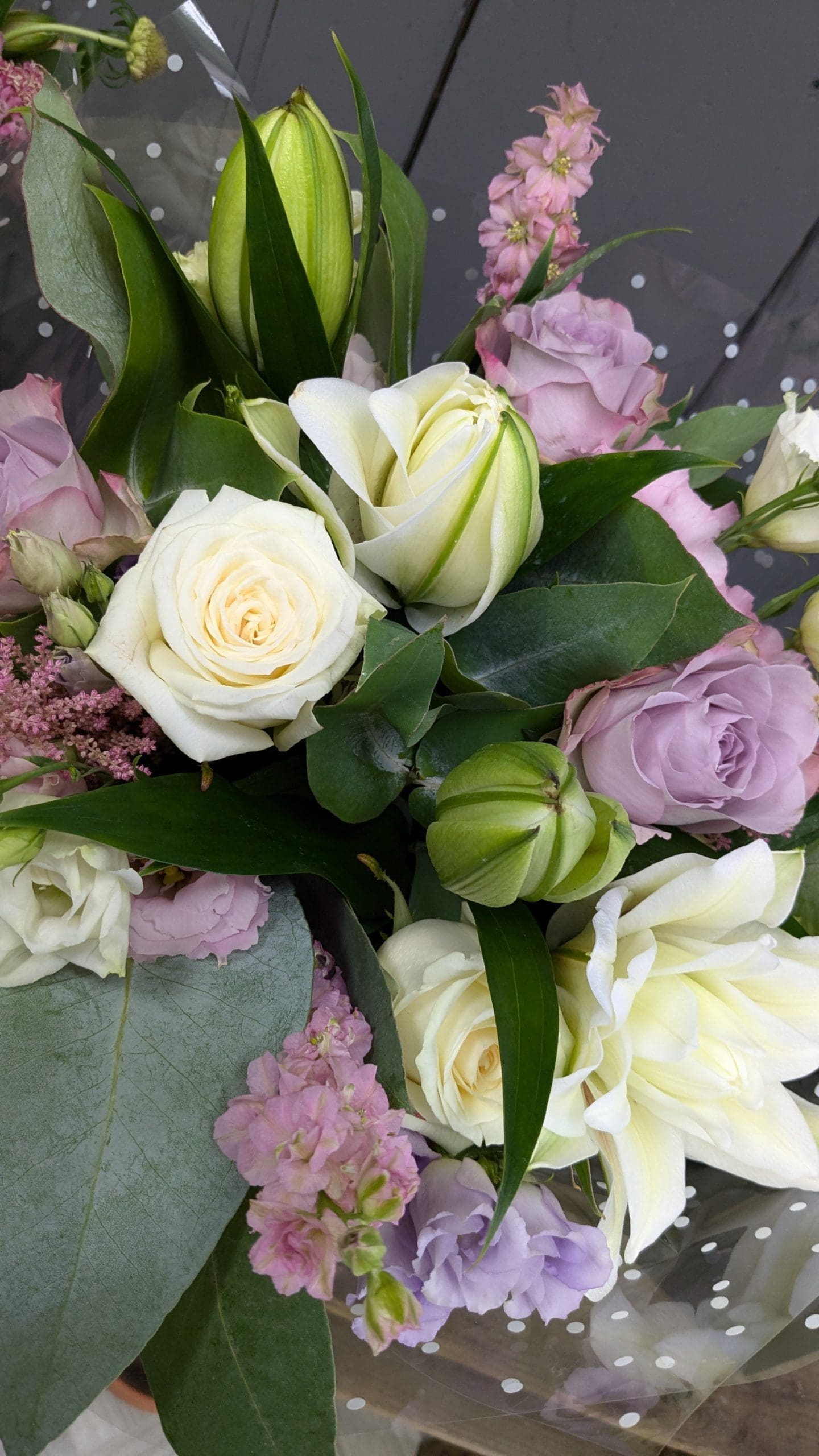 florist choice bouquet close up of flowers with pink and white colours, lilies and foliage