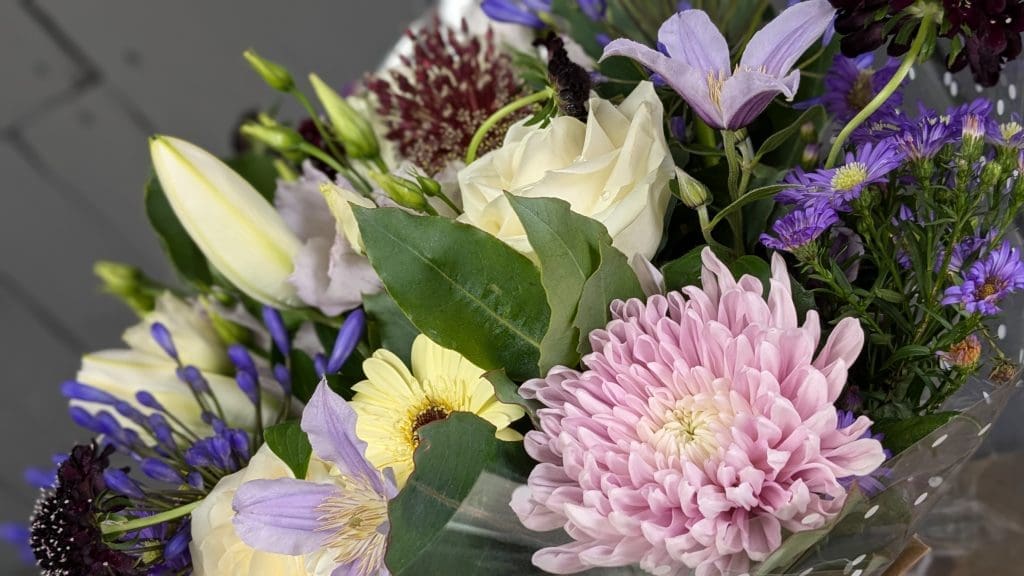 Pink and white flowers in a floral bouquet
