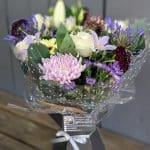 A Florist's Choice Bouquet of pink and lilac coloured flowers
