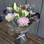 A bouquet of pink and lilac coloured flowers close up